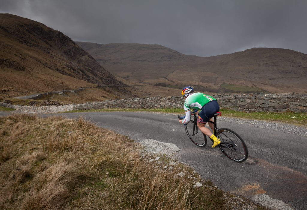 Triathlete Con Doherty cycling in the Doolough Valley, County Mayo, Ireland.